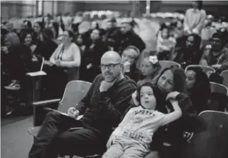  ??  ?? The family of a competitor watches Saturday’s Spanish Spelling Bee.