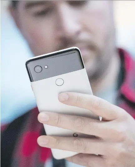  ?? DAVID PAUL MORRIS/BLOOMBERG ?? Google unveiled its new smartphone­s, Pixel 2 and Pixel 2 XL, pictured, on Wednesday during a keynote in Mountain View, Calif. Its devices borrow from Apple’s playbook, but also introduces new features through its integrated hardware, software and AI.