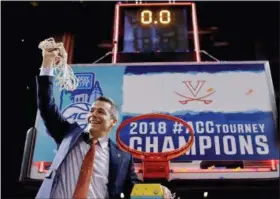  ?? THE ASSOCIATED PRESS ?? FILE - In this file photo, Virginia head coach Tony Bennett holds up the net after defeating North Carolina in the championsh­ip game of the NCAA Atlantic Coast Conference men’s college basketball tournament, in New York. Bennett was named The...
