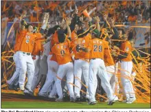  ?? (AP) ?? The Uni-President Lions players celebrate after winning the Chinese Profession­al Baseball League in Tainan, central Taiwan, in 2009.