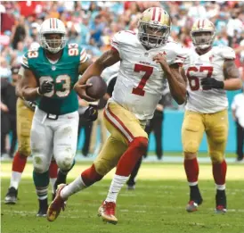  ?? | ERIC ESPADA/ GETTY IMAGES ?? Colin Kaepernick racked up 114 rushing yards against the Dolphins last Sunday and is again looking like the dangerous player he was three years ago.