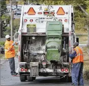  ?? BOB ANDRES/AJC FILE ?? A city of Atlanta garbage crew collects trash. The department needs more staffers, newer vehicles and better, more up-to-date equipment, an audit found.