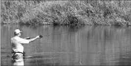  ?? Buy this photo at YumaSun.com FILE PHOTO BY RANDY HOEFT/YUMA SUN ?? JOSEPH WILLIAMS TRIES his hand at fishing the Colorado River while wading into the water at the new Playa Linda in the West Wetlands Park.