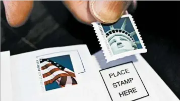  ?? PAUL SAKUMA/AP 2011 ?? The U.S. Postal Service is seeking greater regulatory leeway to increase prices, including a 1-cent rate increase provided in a measure being considered by Congress. The postal service reported a quarterly loss of $562 million Wednesday.