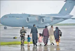  ?? AFP ?? Passengers at the Hindon Air Force Station in Ghaziabad after being evacuated from Kabul, Afghanista­n on August 22.