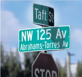  ?? CARLINE JEAN/SOUTH FLORIDA SUN SENTINEL ?? The City of Pembroke Pines dedicated the intersecti­on of Taft Street and Northwest 125 Avenue to honor the memories of Alexandra Abrahams, 14, and Cassie Tianna Torres, 15, who were struck by cars and later died.