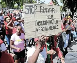  ?? / ESA ALEXANDER ?? EFF supporters march towards Brackenfel­l High School in Cape Town following alleged racism.