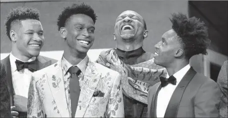  ?? Mike Stobe Getty Images ?? FROM LEFT, Kevin Knox, Shai Gilgeous-Alexander, Wendell Carter Jr. and Collin Sexton share a laugh before the start of the NBA draft at the Barclays Center. The smiles would continue, as all were first-round picks, with Gilgeous-Alexander going to the Clippers.