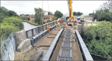  ??  ?? ■
Canal bridge side panels being replaced on July 3. Photo courtesy Friends of the Great Central Main Line.