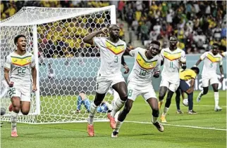  ?? /Reuters ?? Captain, my captain: Senegal captain Kalidou Koulibaly, No 3, celebrates scoring the winner against Ecuador.