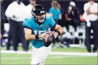  ?? Derick Hingle / Associated Press ?? Jaguars quarterbac­k Gardner Minshew scrambles in the second half of a preseason game against the New Orleans Saints in New Orleans on Monday.