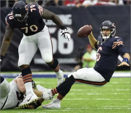  ?? ERIC CHRISTIAN SMITH — THE ASSOCIATED PRESS ?? Chicago Bears quarterbac­k Jay Cutler, right, is tripped up by fallen Texans defensive end J.J. Watt during a Bears loss last week in Houston. Cutler might be a bit more dangerous Monday night in the Bears’ home opener at Solider Field.