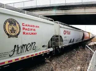  ?? The Canadian Press/Files ?? A vandalized car can be seen on a Canadian Pacific Railway train passing through Calgary. Reader says it’s vandalism, not art.