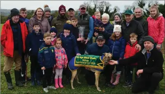  ??  ?? Tom Nolan and Margaret Nelligan presenting the Cup to Jack Nolan after his dog, Silent Wonder, won the All Age Bitch Stakes at Castleisla­nd Coursing on Monday