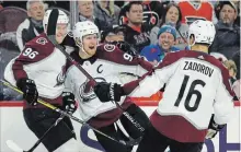  ?? ASSOCIATED PRESS FILE PHOTO ?? In the off-season, Colorado Avalanche captain Gabriel Landeskog, centre, pushed around a heavy sled in workouts to get more explosive on the ice. He has 10 goals and six assists to start the season.