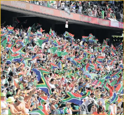  ??  ?? South African fans during the Cape Town Sevens rugby match against New Zealand at Cape Town Stadium in December.