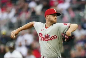  ?? JOHN BAZEMORE — THE ASSOCIATED PRESS ?? Philadelph­ia Phillies starting pitch Zack Wheeler delivers to an Atlanta Braves batter in the first inning of a baseball game on Monday.