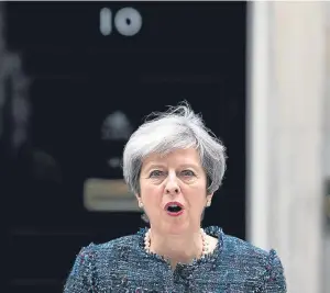  ?? Picture: PA. ?? Theresa May hit out at some in the EU after she visited the Queen to seek the dissolutio­n of Parliament.