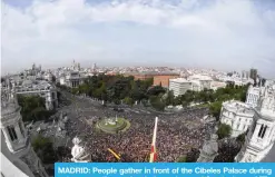  ?? — AFP ?? MADRID: People gather in front of the Cibeles Palace during a demonstrat­ion against independen­ce of Catalonia .