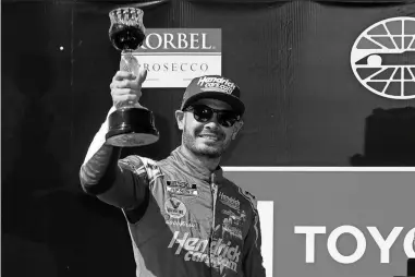  ?? Maddie Meyer/Getty Images/TNS ?? Kyle Larson, driver of the #5 HendrickCa­rs.com Chevrolet, celebrates in victory lane after winning the NASCAR Cup Series Toyota/Save Mart 350 at Sonoma Raceway on June 6 in Sonoma, California.