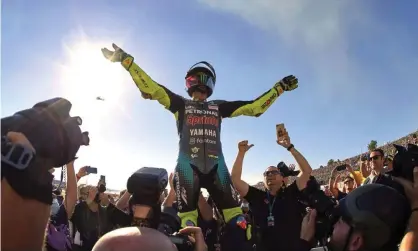  ?? ?? Valentino Rossi salutes the crowd after his final race. Photograph: Pablo Morano/Reuters