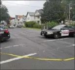  ??  ?? Police vehicles block off a portion of Sixth Avenue in Troy.