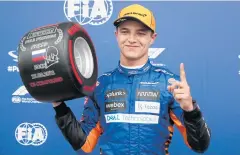  ?? REUTERS ?? McLaren’s Lando Norris celebrates pole position in Russia last month.