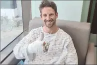  ??  ?? Haas F1’s French driver Romain Grosjean tweeted this picture of his on Monday from the hospital after he survived a hi-speed crash and fireball blaze during the opening lap of the Bahrain Grand Prix on Sunday.
