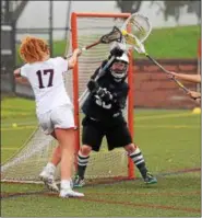  ?? AUSTIN HERTZOG - DIGITAL FIRST MEDIA ?? Spring-Ford goalie Brenna Whiteside saves a close-range shot from Owen J. Roberts’ Eloise Gebert during their District 1-3A playoff game Wednesday.