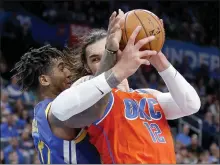  ?? [SARAH PHIPPS/ THE OKLAHOMAN] ?? Oklahoma City's Steven Adams (12) goes to the basket against Golden State's Marquese Chriss (32) during the Thunder's 120-92 win on Oct. 27.