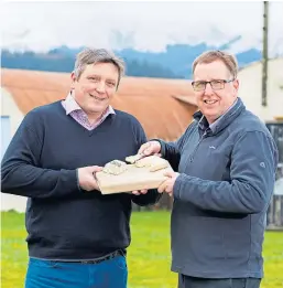  ??  ?? Strathearn Cheese Co founders Pierre Leger and Drew Watson with some of their awardwinni­ng products.