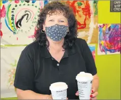  ??  ?? KINDNESS IN A CUP: Deb Jackson serves up two coffees at Deb’s Diner in Ararat supporting Resilience Ararat’s #beanresili­ent campaign.