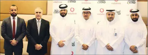  ??  ?? Dignitarie­s from Vodafone Qatar and Astad after the signing ceremony.