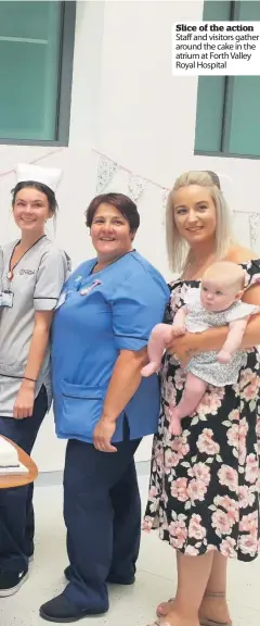  ??  ?? Slice of the action Staff and visitors gather around the cake in the atrium at Forth Valley Royal Hospital Generous Robertson Group staff took a break from building the new care village to deliver a cake to Stirling Community Hospital staff and...