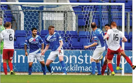  ??  ?? SWEET SIXTEEN: Kilmarnock sub Scott Boyd scrambles home his team’s winner as Saints defenders can only look on