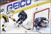  ?? Andy Cross / The Denver Post ?? Colorado Avalanche goaltender Darcy Kuemper (35) blocks a wrap-a-round shot by Nashville Predators right wing Michael McCarron (47) in the second period of the first round of the Stanley Cup playoffs at Ball Arena May 3. Colorado Avalanche center Andrew Cogliano (11) defends on the play.