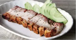  ??  ?? Boon’s siew yoke is tender, with a lovely, subtle flavour of herbs and spices, and a deliciousl­y crunchy crackling.