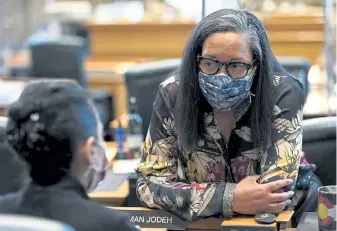  ?? Helen H. Richardson, The Denver Post ?? State Reps. Iman Jodeh, left, and Dominique Jackson chat in the House chambers during Monday’s session.