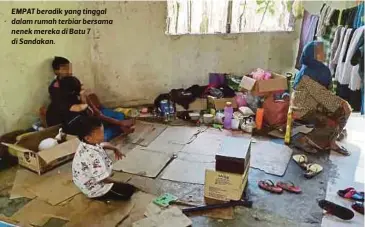  ??  ?? EMPAT beradik yang tinggal dalam rumah terbiar bersama nenek mereka di Batu 7 di Sandakan.