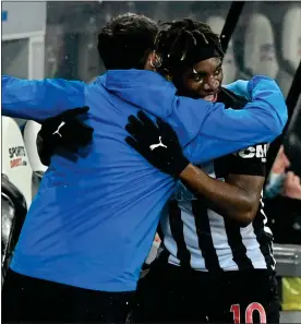  ??  ?? GLOVE STORY: Allan Saint-Maximin is hugged after putting Newcastle ahead during an outstandin­g display from the dynamic playmaker in last night’s win