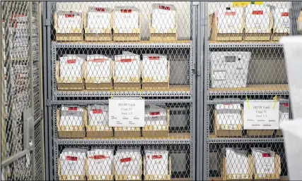  ?? KENT D. JOHNSON / AJC ?? Rape kits in the vault at the GBI. After state law changed July 1 to require hospitals and law enforcemen­t agencies to account for kits they still had, the GBI got a stunning call from Children’s Healthcare of Atlanta. There were 205 child rape kits...