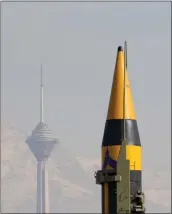  ?? VAHID SALEMI — THE ASSOCIATED PRESS ?? An Iranian-built missile is displayed during a rally in Tehran, Iran, Feb. 11.