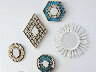  ?? WEST ELM ?? This collection of decorative mirrors made by Peruvian artisans was inspired by the intricate carpentry in old colonial homes. Global accents are key elements in a boho-style nursery.