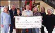  ??  ?? Turnback: The Commission­er of State Lands presented a check yesterday at the Union County Courthouse. Pictured, from left, are County Treasurer Debbie Ray, County Judge Mike Loftin, County Circuit Clerk Cheryl Cochran-Wilson, Commission­er of State...