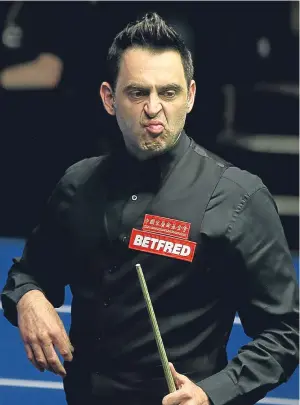  ?? Picture: Getty. ?? Ronnie O’Sullivan reacts after playing a shot yesterday.