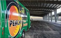  ?? ?? Peachy Airport Parking’s new covered lot will help ease the parking crunch at Hartsfield-Jackson. The timing is fortuitous: March 29 is expected to be one of the airport’s busiest days of the year.