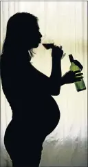  ??  ?? OFFSIDE: A pregnant woman drinking alcohol