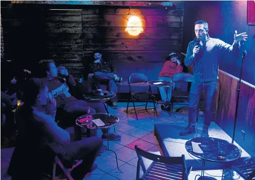  ??  ?? YOU GOTTA BE KIDDING ME: Mark Benjamin performs during an open-mike stand-up comedy session at the Klimat Lounge in New York.