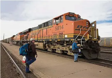  ?? — Bloomberg ?? Higher earnings: A file picture showing a BNSF Railway Company train loaded with coal stopping for a crew change at a railway station in La Junta. The business reported profit rising 24% to US958mil.