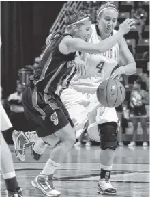  ?? STAFF FILE PHOTO ?? UTC’s Tagan Hatchett (4) tries to drive the ball while Georgia’s Ashley Houts, from Dade County, defends in this 2009 photo. Houts has been hired as director of basketball operations at Missouri State.